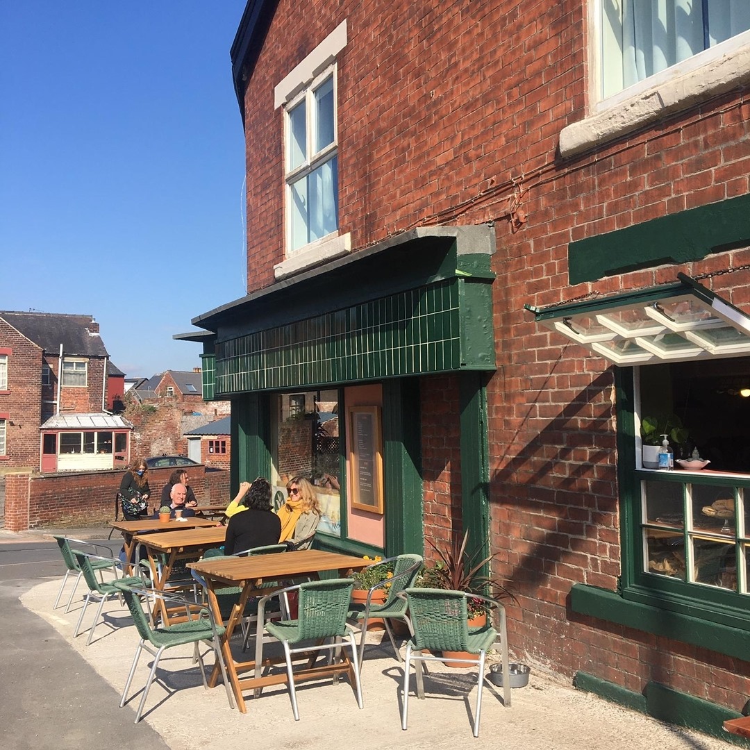 Tables set up outside Kopi & Chai.