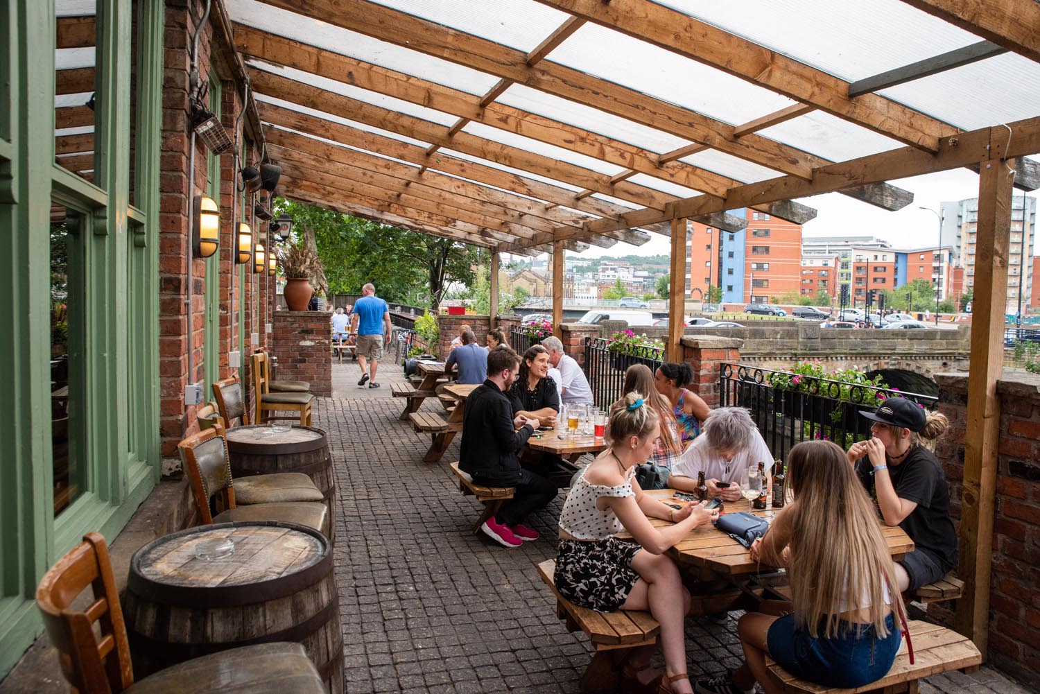 People drinking on the outdoor terrace at The Riverside Kelham.